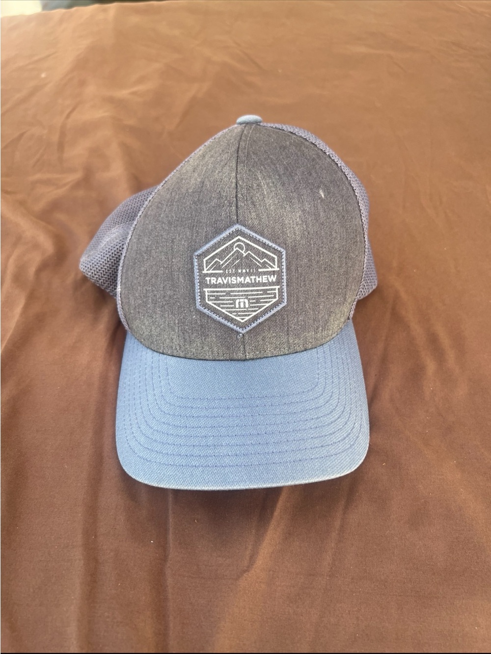 Travis Mathew Two-Tone Blue and Charcoal Mesh Trucker Hat